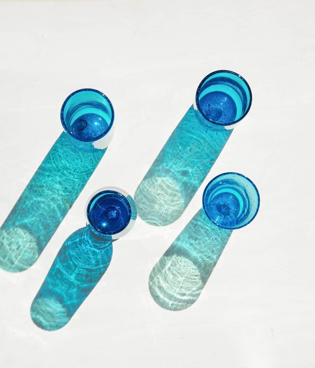 The Little Marketのインスタグラム：「These blue bubbled beauties are the perfect addition to your outdoor dining collection. They shimmer in the sunlight and brighten up your tablescape. Shop our best-selling glassware collection before it's gone for good. 💙」