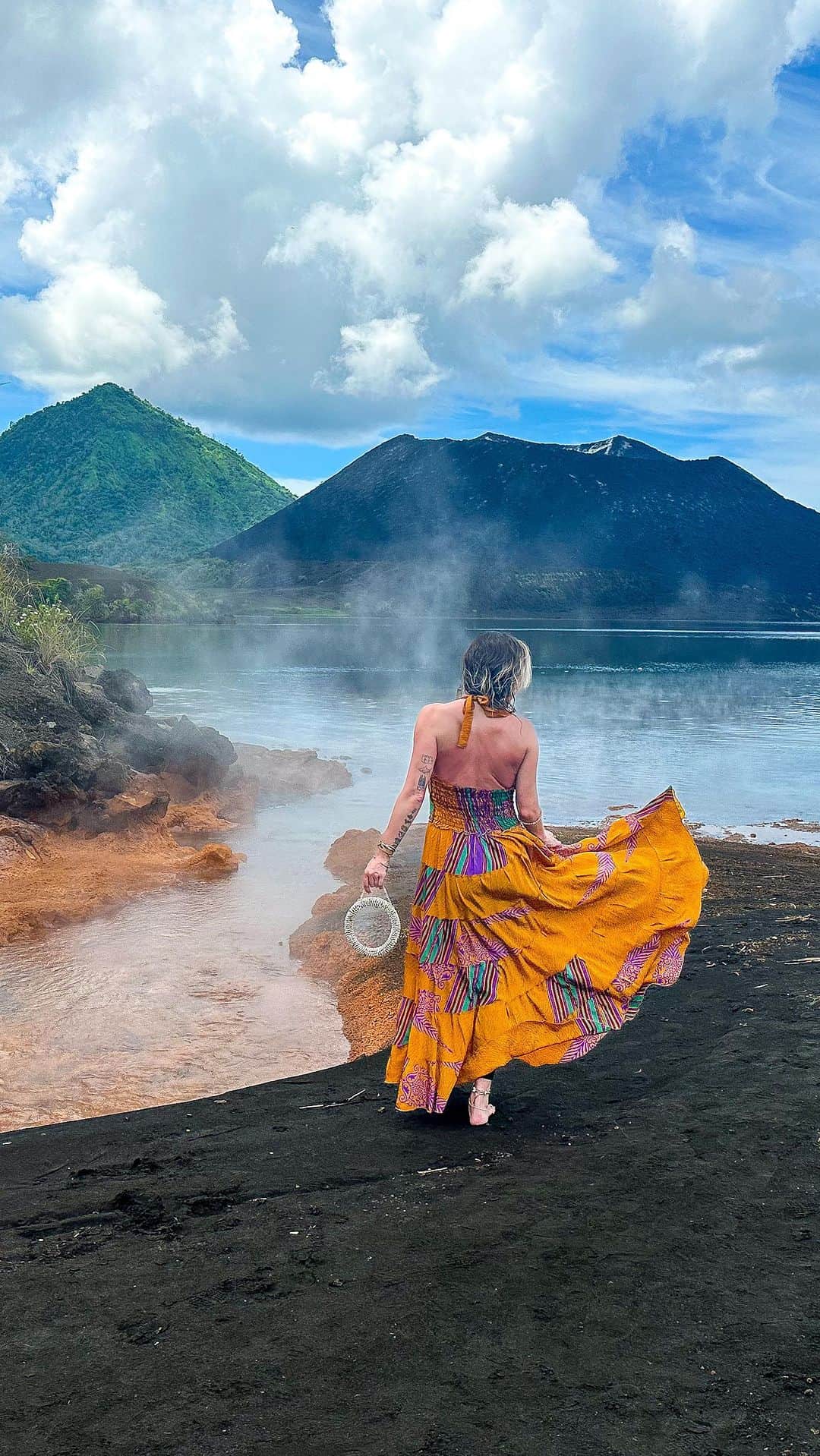 アリサ・ラモスのインスタグラム：「“Dangerous” things I did in Papua New Guinea that had nothing to do with crime or people: Climb an active volcano!  This is Mt. Tavurvur, the smallest of the three volcanoes you’ll constantly see if you go to the Duke of York Islands, and the only active one.  It’s only about a 45 minute climb up lava gravel, and the view from the rim is breathtaking! Inside the volcano you can see smoke rising, and when you turn around, you have a drones-eye-view of the islands below!  After the hike, your local guides can show you a hot spring on the shore where they boil eggs! The view of this natural phenomenon where the hotspring meets the sea is absolutely stunning as well!  You can also buy a few souvenirs from the local women here – I got a mini “shell money” ring, and learned that to this day they still use the bigger versions as forms of payment for things like marriage!  Also, this might be the first photo/video of someone wearing a long dress at the rim of Mt. Tavurvur…should I also show my steamy volcano wardrobe change ? 😂  Would you climb an active volcano?  Tap the link in bio for more info on where I went in PNG, how you can go there, and to pre-sign up for our limited edition group trip here!  #pngpride #papuanewguinea #dukeofyorkislands #pngtribal #pngtribalfoundation #mylifesatravelmovie #mttavurvur」