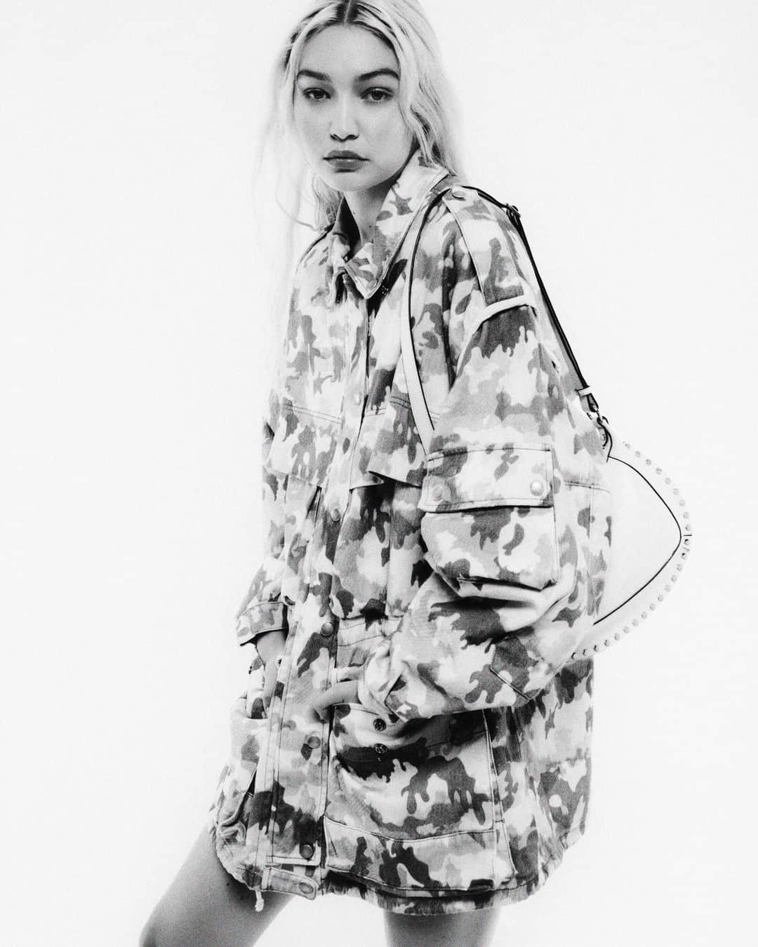 イザベルマランのインスタグラム：「Bringing back the camouflage print. @gigihadid wears the #IsabelMarantSS23 collection, photographed by @vitofernicola.  Discover more via the link in bio.  #IsabelMarant」