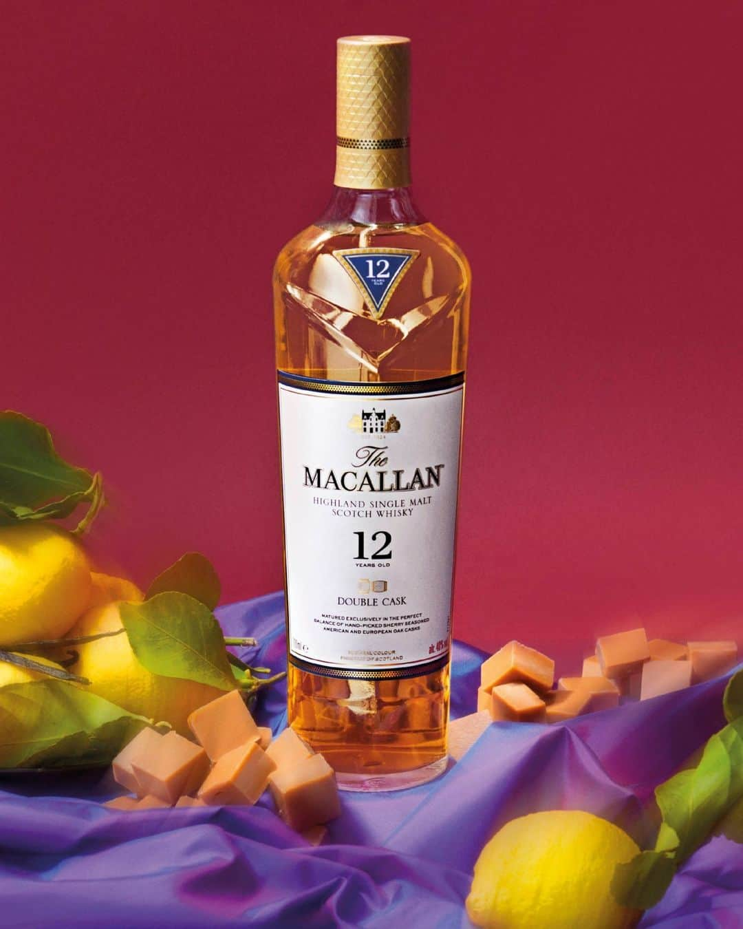 The Macallanのインスタグラム：「A collaboration with acclaimed artist @erikmadiganheck distinctively captures The Macallan Double Cask 12 Years Old. ⁣ ⁣ Notes of candied lemon citrus and smooth fudge are portrayed alongside subtle hints of vanilla, while the two - tone purple chiffon fabric is a nod to the beautiful balance of sherry seasoned American and European oak casks, the defining feature of the Double Cask Collection. ⁣ ⁣ Crafted without compromise. Please savour The Macallan responsibly.⁣ ⁣ #TheMacallan #TheMacallanDoubleCask」