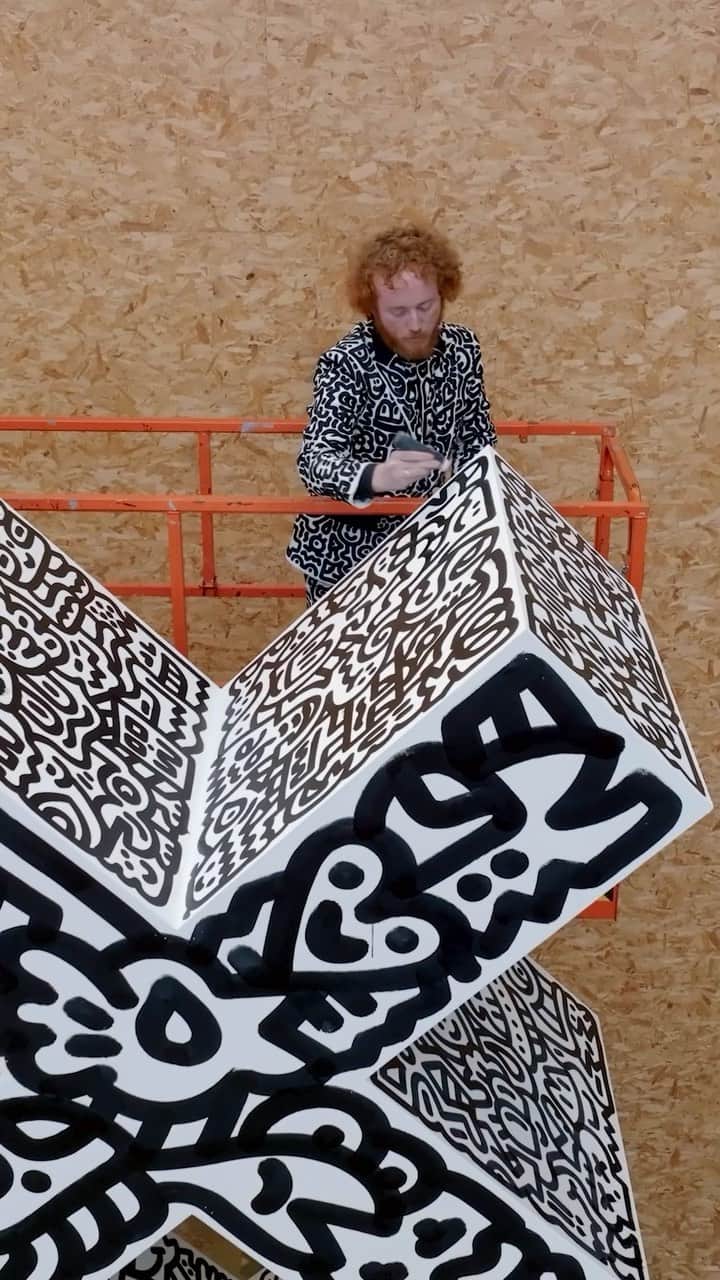 レッドブルのインスタグラム：「it doesn’t get much more iconic than this 👆  international artist @mrdoodle bringing unique art to Amsterdam’s iconic 3X symbol at @straatmuseum ahead of the Red Bull Doodle Art World Final in May. we can’t wait to see what’s in store 👀   #redbull #givesyouwiiings #RedBullDoodleArt #doodle #art #drawing」