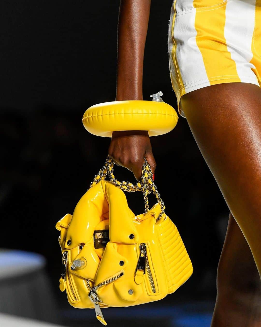 Moschinoのインスタグラム：「Yellow, is it me you’re looking for?  Discover the #MoschinoSS23 collection, filled with straight-from-the-runway accessories in the most radiant hues.    #Moschino #MoschinoBags #MoschinoBikerBag」