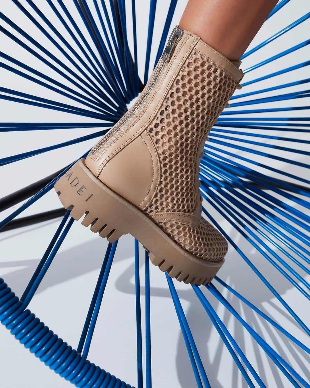 カサディのインスタグラム：「The maxi-volumes of technical work shoes merge with Casadei’s distinctive femininity in mesh-tights-look details. #CasadeiWorld」