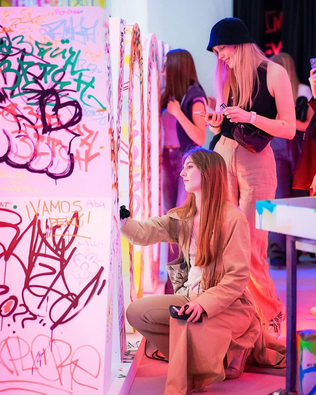 YOOX.COMのインスタグラム：「A first photo dump of THE COLOUR SQUAD - Designing Tomorrow Together event, where #YOOXERS passed by and left their sign! @dformichetti performed live personalising a wall of t-shirts and @evissimax - a music experience by @idaysmilano - wrapped the day with her tunes! Keep up to discover what's next tomorrow and come to visit us in via Tortona 32!」