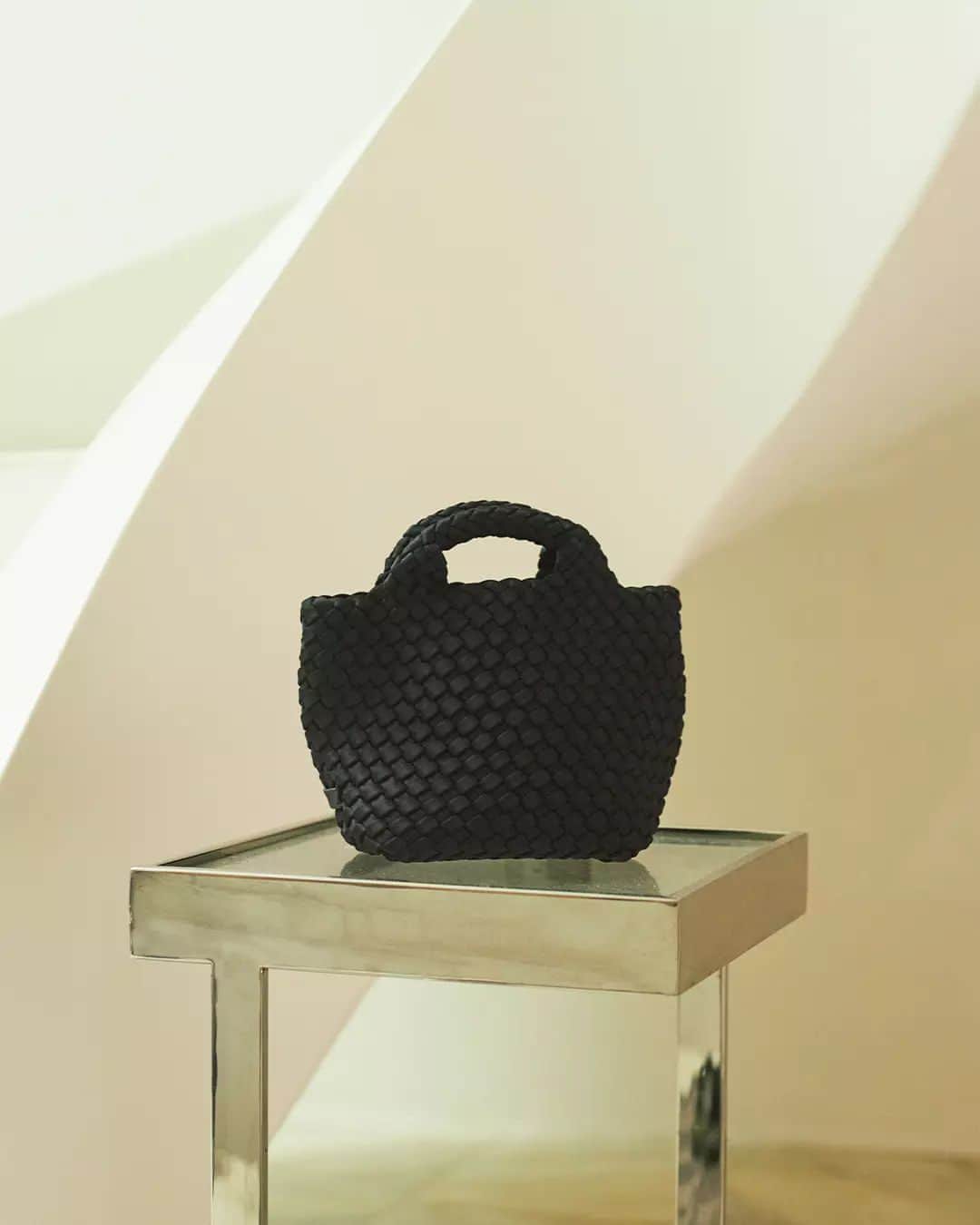 ベイシークのインスタグラム：「new in accessories.  featuring the st barths petit tote by @naghedinyc. individually hand-woven and designed with versatility and style in mind.   #bassike」