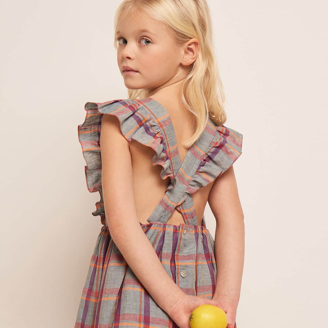 のインスタグラム：「Bonpoint SS23 | Cross my heart. ​ Timeless checked dress with airy ruffles details and criss-cross straps at the back. ​  #Bonpoint #BonpointSS23」