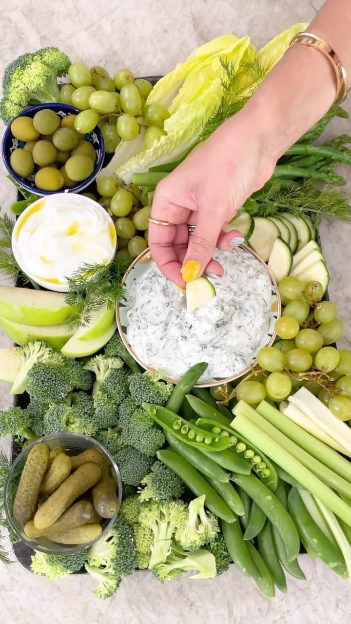 Chobaniのインスタグラム：「Take your grazing game to the next level with @themediterraneandish Green Goddess Board! This simple Mediterranean diet snack board is a great way to use up any veggies and greens you have on hand. The herby Greek Yogurt  dip, made with our @chobani Organic Whole Milk Plain Greek Yogurt is a must to make this board luxurious and extra satisfying! Don’t forget to SAVE this idea for when you don’t feel like cooking. It’s also perfect for Mother’s Day (hint hint). #grazingboard #veg #crudités #greekyogurt #yogurt #mezze #mediterraneandiet #mothersdaybrunch #mediterraneanfood #mediterraneandish #whatsfordinner #easyrecipes #simplefood #springfood  🌿 For the Yogurt Dip 🌿 • 2 cups Chobani Whole Milk Plain Greek Yogurt • 1-2 garlic cloves, minced or grated • 1/2 cup chopped fresh parsley • 1/2 cup chopped fresh dill • 1/4 cup chopped fresh mint • Kosher salt and black pepper, to taste  🥬 For the Green Goddess Board 🥬 • Zucchini, broccoli, lettuce, snap peas, and asparagus • Granny Smith apples and green grapes • Olives and pickles  1️⃣ Make the Herby Yogurt Dip. In a small mixing bowl, combine the yogurt, garlic, fresh herbs, and a big pinch of salt and black pepper. Whisk until the herbs are well-incorporated. Taste and adjust seasoning to your liking. Transfer the dip to a small serving bowl. 2️⃣ Prepare the vegetables and fruit. Wash and dry the vegetables and fruit well. Trim and slice them however you like (I like different shapes on the board). If you are adding asparagus to your board, blanch it in boiling water for 3 to 4 minutes or until just tender, then transfer to a bowl of iced water to stop the cooking (this will keep the asparagus bright green). 3️⃣ Assemble the Green Goddess Board. Place the Herby Yogurt Dip bowl in the center of a serving board or platter. Arrange the produce on the board around the dip. Add olives and pickles in smaller bowls and place them on opposite sides of the board. Fill any remaining gaps on the board: I like to cover empty spaces with fresh herbs or an additional small bowl of yogurt drizzled with olive oil.」