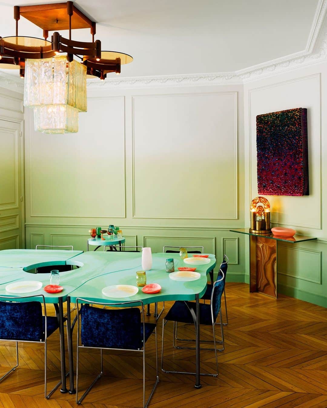 ELLE DECORさんのインスタグラム写真 - (ELLE DECORInstagram)「“We imagined walking into our jewel box, each gem blown up to an architectural scale,” the owner of this ebullient Parisian apartment tells us. “That is exactly what we got.” The resulting out-of-this-world rooms are the handiwork of designer Julien Sebban, founder of Uchronia (@uchronia_world). In the dining room, the green gradient walls were inspired by malachite. But the custom table—made in seven pieces so it can be pulled apart— is the real jewel here. It seats 16, and the center can be removed and used as a side table for serving. All in all there are 40 legs, each of which is treated like a piece of jewelry, rendered from hammered steel.  Click the link in bio to tour the rest of this boundary-busting residence, as shown in our May 2023 issue. Written by @gaygassmann. Photographed by @felixdolmaillot.」4月20日 7時00分 - elledecor