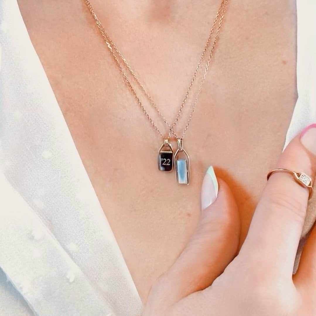 ベサニー・ジョイ・レンツのインスタグラム：「LAST WEEKEND TO ORDER custom pieces BEFORE MOTHERS DAY  • Two versions of our Shield Heirloom necklace. Both 14k gold. Both personally engraved in NYC. One with a secret rotation and mother of pearl inlay. Both made to last for generations. (Honorable mention to the subtle, elegant pave diamond shield ring ;) Link in bio 🪐 @sophieratner_jewelry」