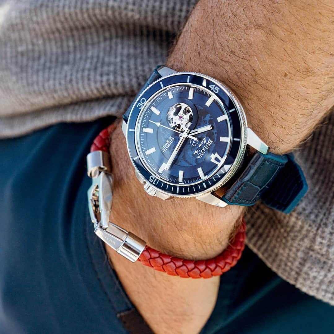 ブローバのインスタグラム：「Sail into your work days while keeping your weekend vibes afloat with the sporty elegance of the Marine Star Automatic.   Featuring a tinted exhibition dial with an open heartbeat that showcases the intricate 21-jewel movement, plus a stylish blue grain embossed leather strap with a silicone base for ergonomic comfort.  #Bulova #BoldatHeart  — ⏱: 96A291 MSRP: $595 CASE: ø 45mm」