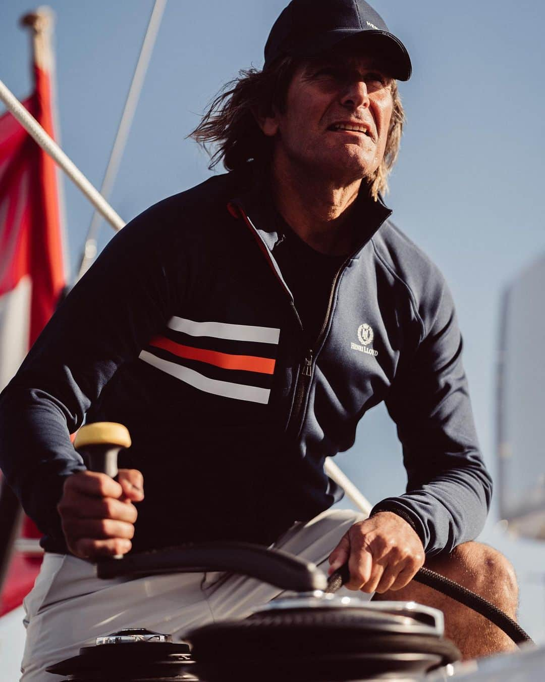 ヘンリロイドのインスタグラム：「We're proud to introduce the new FREO AKTIV STRETCH, a special limited-edition piece in honour of our 60th anniversary. Drawing inspiration from the kit worn by Dennis Conner during his historic 1987 America's Cup victory in Fremantle, this mid layer is crafted from recycled PET bottles and engineered to be fast drying. Featuring the iconic Henri-Lloyd Crown and Laurels logo, a symbol of excellence and trust in the world of sportswear and yachting, this limited-edition garment embodies our commitment to quality and responsible design.   Shop now by clicking the link in our bio - HL  #yachting #active #jacket #recycled」