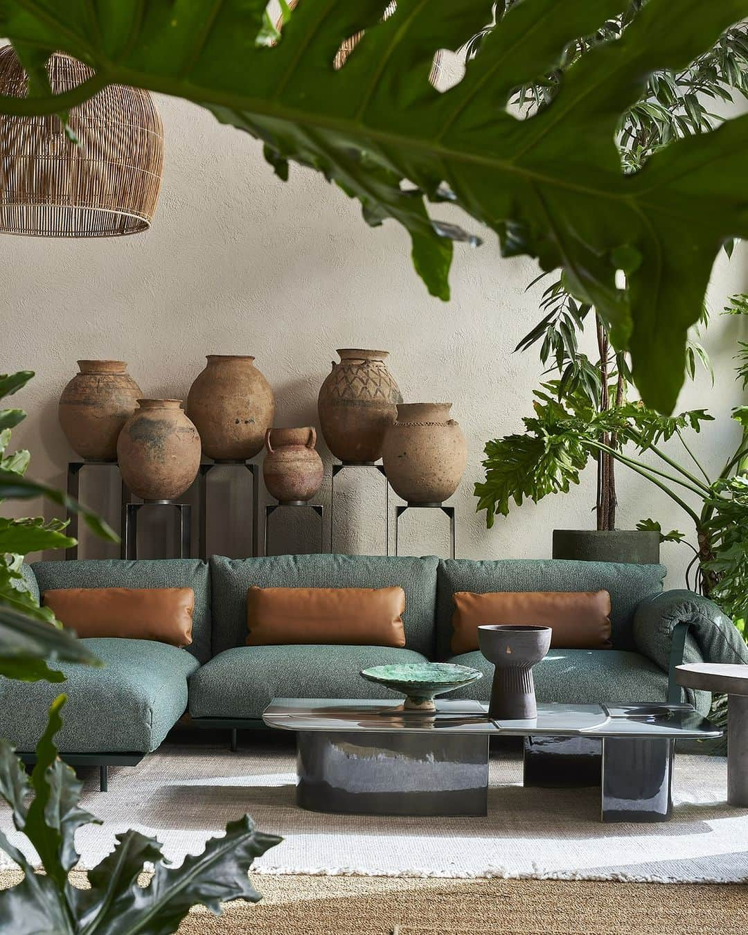 Baxterのインスタグラム：「Forest green, olive green, ivory, air force blue, iroko wood: at the Baxter Outdoor Gallery, there is the whole palette of an oasis between the Mediterranean and the Equator. The 2023 restyling retains the atmosphere of a secret garden, embellished with plant compositions and artefacts from around the world, while leaving plenty of room for new compositions and finishes ✨  Discover Baxter Outdoor Gallery at via Filippo Turati 2, Milan  Ph. @fabriziocicconi_ph  #baxtermadeinitaly #baxtercinema #leather #design #interiordesign #madeinitaly #milan #italy #luxury #interior #milanodesignweek2023 #outdoor」