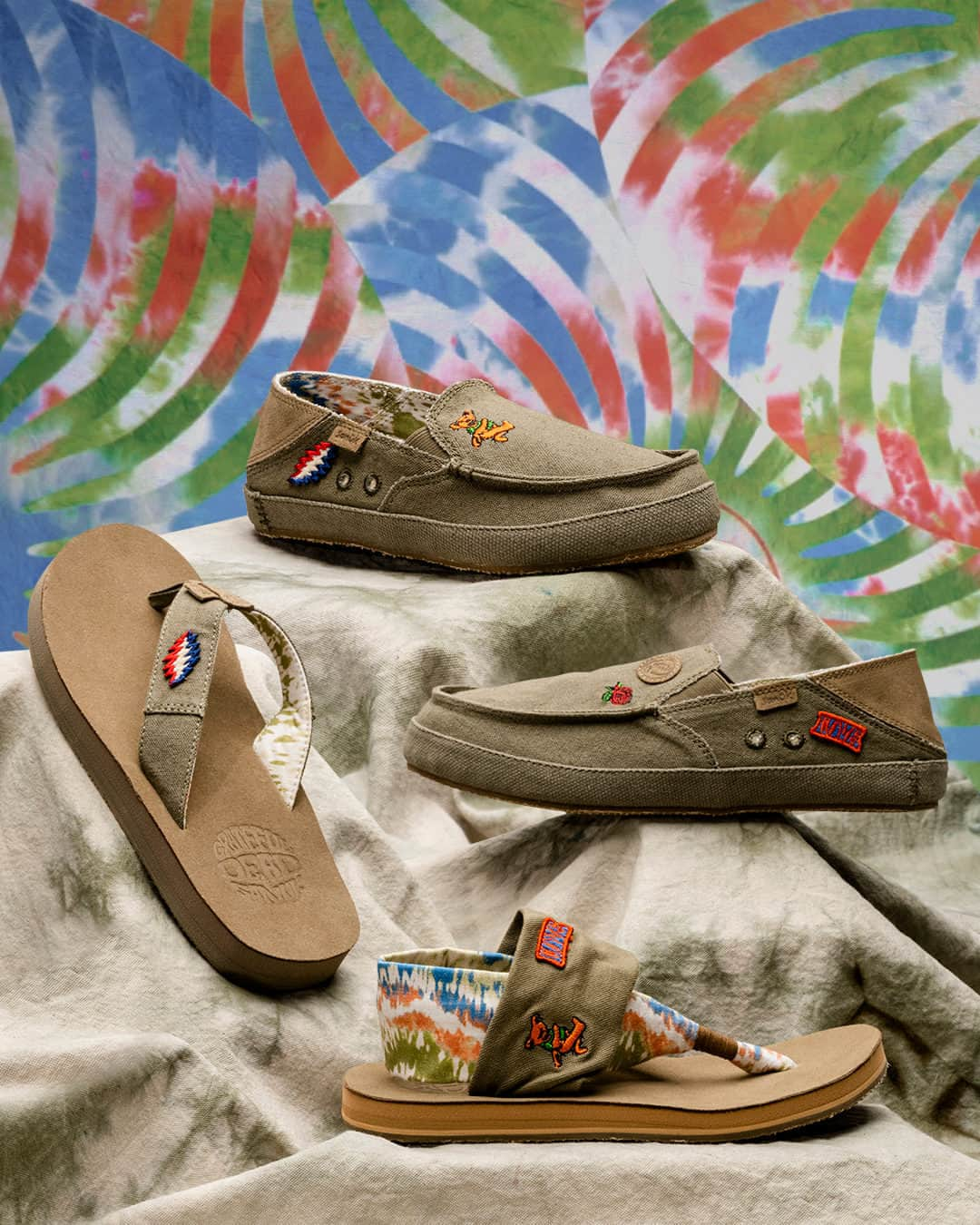 サヌークのインスタグラム：「Enjoy cloud nine comfort with another set of @gratefuldead Sanuks!  Our legendary hits are remixed and customized like a vintage military jacket — starring embroidered patches, embossed emblems, and nostalgic flair.   It’s like a miracle...for your feet.  #SmilePassItOn #SmileOn #Sanuk #GratefulDead #DeadHead」