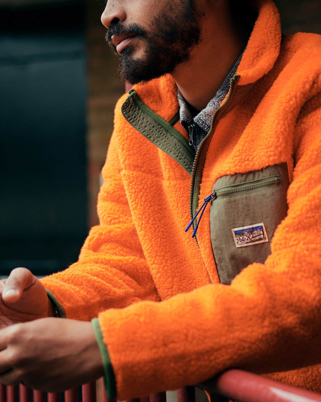 MR PORTERのインスタグラム：「The fuzzy fleece may seem like it should be reserved for the winter months. But when the weather can turn (and most likely will) in a moment's notice, it remains an essential for Spring. It's a practical choice, but this bright orange option from @poloralphlauren proves it's a stylish one too.  Tap to shop and head to the bio to discover the foundational pieces to invest in.」