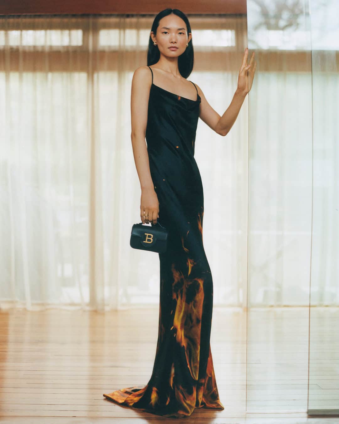 ネッタポルテのインスタグラム：「NEW FLAME: Make an entrance with a dress that steals the show. @Balmain's satin gown is on the top of today's wish list. 🔥  Tap the link in bio to shop at #NETAPORTER.」