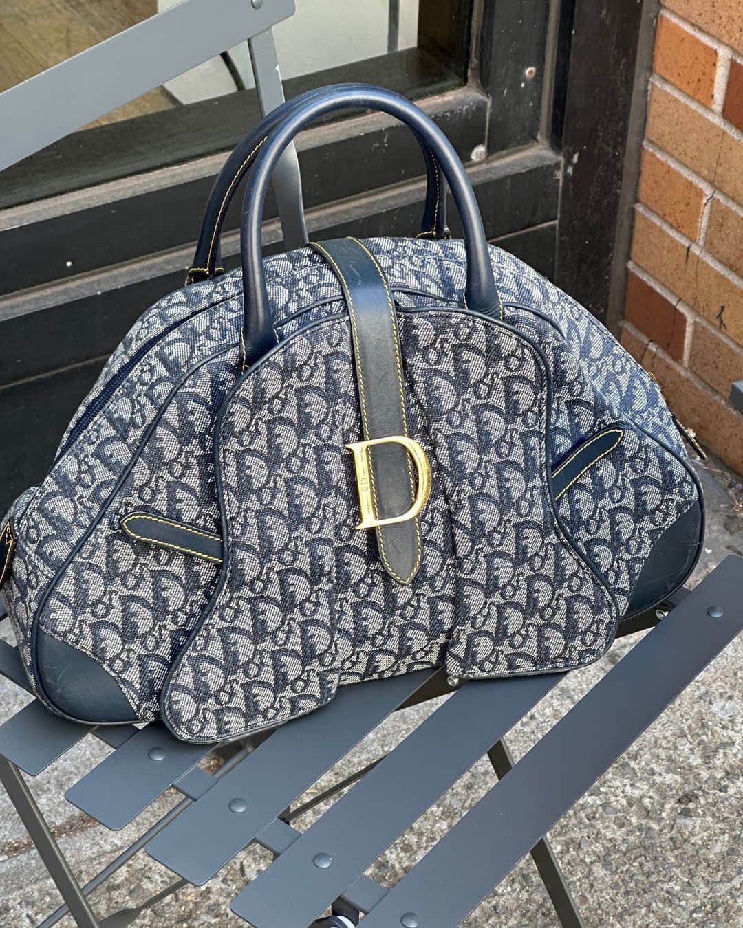 ワットゴーズアラウンドカムズアラウンドのインスタグラム：「This chic and trendy Dior Bowler Bag from 2001 makes for the perfect work bag」
