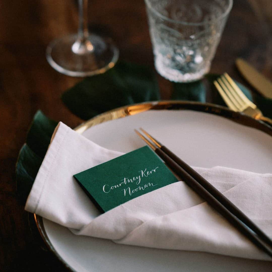 Ceci Johnsonのインスタグラム：「‘Til death do us a party. ✨   As seen in @TheKnot: "When it came to additional decor, the couple left the accessories to a minimum for one very specific reason: 'We kept the tabletops fairly clean and crisp, because we wanted them to be free from clutter so guests had plenty of room to jump on them at any point of the night to dance.'"  Placecards were a must for our bride @Kerrently! #CeciNewYork incorporated a rich forest green with delicate white calligraphy as a nod to their invitation design. You can read more about their feature at the link in @CeciNewYork's bio. 🤍  Invitation Design & Event Branding: @cecinewyork Planner: @epicpresentations Event Designer: @epicpresentations 📸 & 🎥: @thebrothersmartens Ceremony & Reception Site: @nikkibeachsaintbarth Florist: @b_floralevents Officiants: Tori Bradburry & Josh Sepkowitz Wedding Dress: @alexperryofficial Reception & After-Party Dresses: @berta via @bblewisville Veil: @bblewisville Suits: @balanicustom Engagement & Wedding Rings: @diamondsdirect Hair and Makeup: @matwulff Wedding Party Attire: @alexperryofficial, @balanicustom Rental Equipment: @nikkibeachsaintbarth Catering: @nikkibeachsaintbarth Cake: @chokolavany.stbarth Entertainment: @nikkibeachsaintbarth, @blackrabbitprojects Welcome Bags: @epicpresentations Transportation: @coolrental  #couturedesign #luxurydesign #luxurystationerydesign #luxuryweddingstationery #luxurysignagedesign #eventbranding #cecicouture #weddingprograms #ceciwedding #placecards #stbarth」