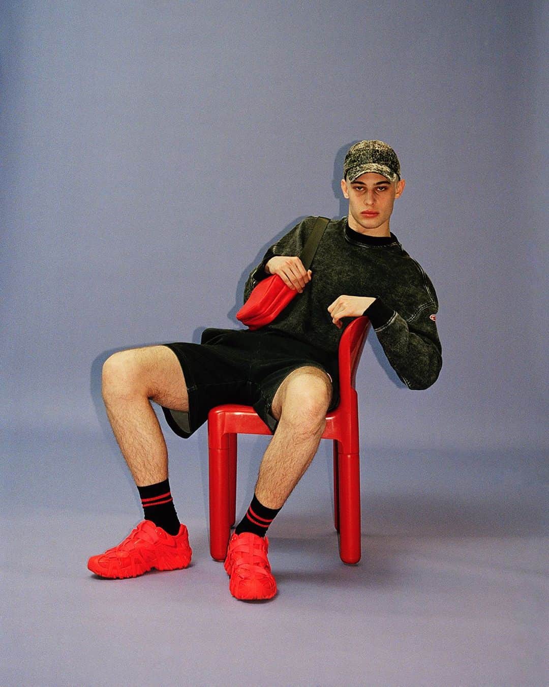 ディーゼルのインスタグラム：「Say nothing. Act casual.   Diesel’s Track Denim does the talking for you, expressing a genuine attitude of laid back, comfortable cool with 90s-inspired shorts, hoodies and trackpants, primarily made with responsible, lower-impact techniques. The Prototype sneaker in bold Diesel red punctuates the look.    Tap to shop and discover more at the link in bio.   #ForSuccessfulLiving」