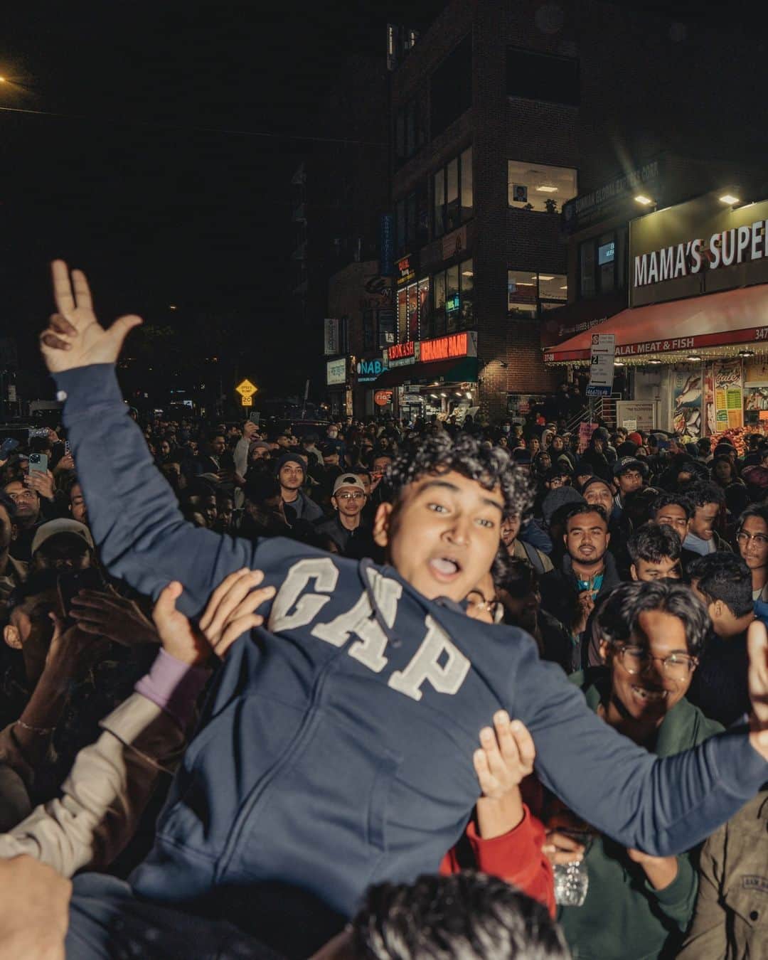 New York Times Fashionさんのインスタグラム写真 - (New York Times FashionInstagram)「South Asian Muslims, both local to New York City and from other boroughs and states, flocked to Jackson Heights on Thursday evening to celebrate Chand Raat, a festival on the night before Eid al-Fitr to herald in the holiday.  The celebration encapsulates the intersection of religion and culture, translating to “night of the moon” in Urdu and Hindi. It’s observed on the last night of Ramadan, when the new moon is sighted, indicating the end of the month of fasting.  The night’s action was centered in Diversity Plaza, the town square that honors the global mash-up of Jackson Heights. With some 180,000 people and 167 languages, it may be the most diverse neighborhood in the world. And it’s home to a prominent South Asian community. “Eid Mubarak!” signs swung over the streets. Punjabi, Bollywood and Bangla anthems blasted from car speakers. Vendors set up tables selling salwar kameez of all colors and elaborate gold jewelry.  “That’s why I come. Because you feel seen,” said Anik Khan, a musical artist and an influential member of the community who has been celebrating in Jackson Heights since he was a kid.  Tap the link in our bio to read more from @sadibahasan about the Chand Raat celebration in Jackson Heights. Photos by @amirbangs」4月25日 1時46分 - nytstyle
