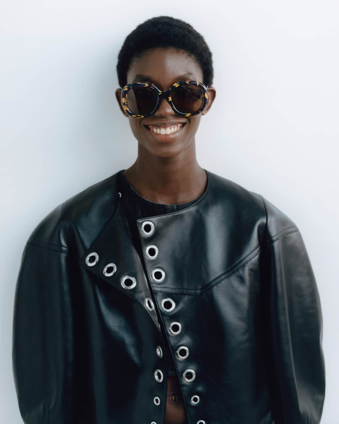 のインスタグラム：「The round shape of the burgundy Gayia sunglasses in recycled acetate is complemented by the curved silhouette of the jacket in Nappa leather with metallic eyelet details.  Model: @laurrreyes  Photographer: @philengelhardt  Discover now: https://bit.ly/3S5VTlv  #ChloeSS23」