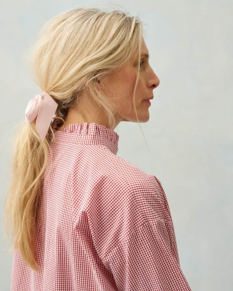 のインスタグラム：「In red and ivory seersucker gingham, the Freddie top is 100% organic cotton with a gathered skirt, a high frill neck and frilled cuffs. A forever favourite C&R style.  #CabbagesandRoses #SS23 #ThisGloriousLife #NewArrivals」