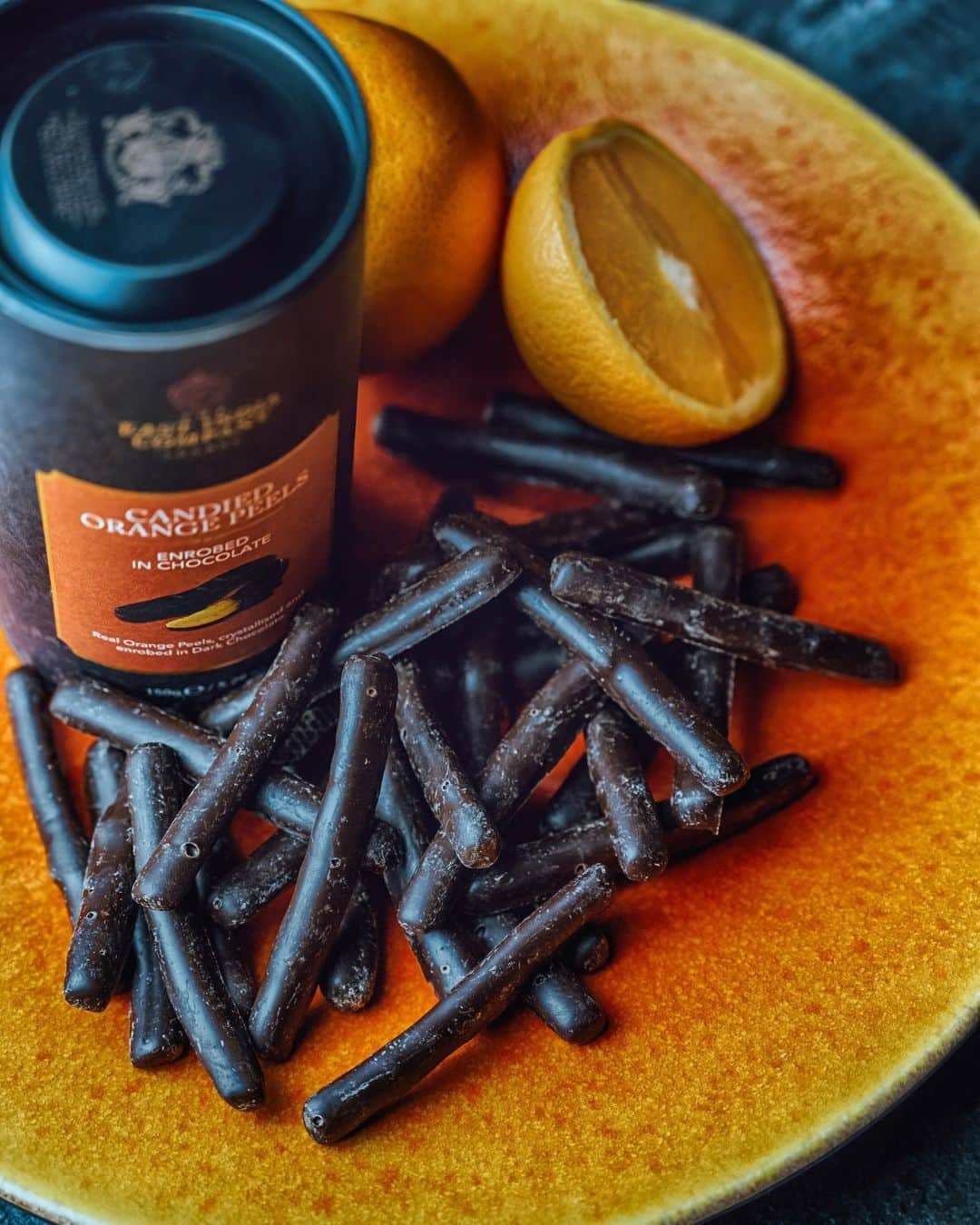 The East India Companyのインスタグラム：「Rich Belgian dark chocolate hides a golden glow of crystallised sweet Sicilian orange peel. Sumptious, sweet, decadent perfection.  #theeastindiacompany #chocolate #artisianchocolate #orange #sicilian #sweet #orangechocolate #sicily #luxury #luxuryfood #finefoods」