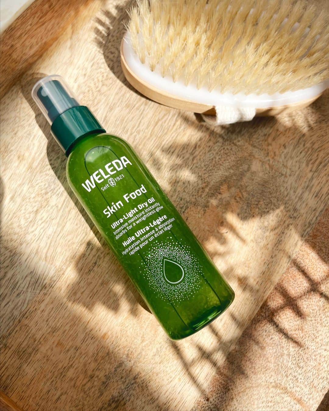 Weledaのインスタグラム：「Did you know? Skin Food Ultra-Light Dry Oil was developed with a unique bi-phase formula! When you shake the bottle, it blends the plant-based extracts and rich oils together to create a lightweight oil that deeply hydrates and nourishes your skin for a luminous glow. 🌿✨ ⁠ ⁠ Shop exclusively on Weleda.com #Weledaskinfood」