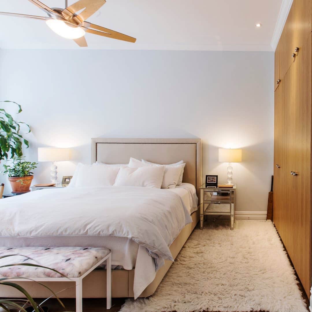 Sweeten Homeのインスタグラム：「Meg and Brett dreamt of a serene and relaxing primary bedroom — a retreat from NYC life. We think they nailed it. Don't you? 🌴☀️ To create their at-home oasis, they redid the floor-to-ceiling closets with custom wooden doors and a hidden TV inside. Their custom wood shutters accentuate the new arch-shaped windows, while still filling the room with tons of natural light. ⁠ ⁠ These are just a few of the many upgrades Meg and Brett made to their loft apartment. Swipe to see the before and after & head to our link in bio to read their #sweetenhome story! ⁠ ⁠ Renovated with Sweeten ✨ ⁠」