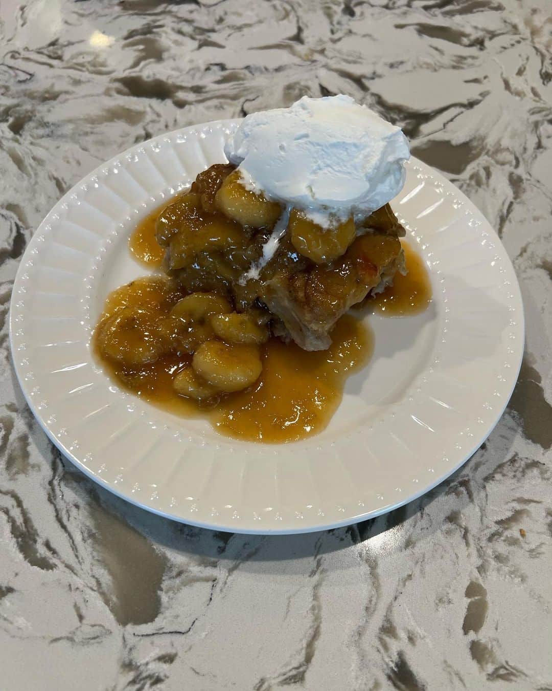 ginger and sproutのインスタグラム：「Bananas foster bread pudding with rum whipped cream! This is on a whole other level! #tjsbananacontest (I got all of my ingredients at Trader Joe’s except the rum and banana liquor) Bread pudding: 2 loaves brioche cut into squares  4 bananas sliced.  1/2 cup brown sugar.  1 Tablespoon vanilla (I used the bourbon one) 2 tsp cinnamon  6 cups milk (any kind will work!). 6 eggs.  Bananas Fosters Sauce: 8 Tbls butter.  3/4 cup brown sugar.  6 bananas sliced.  4 Tbls spiced rum and 4 tbls banana liquor. (Shooters are exactly 4 Tbls)  1tsp salt  Whipped cream: Pint heavy cream.  4 Tbls spiced rum (1shooter). 1/2 c powdered sugar or more if you like sweeter.  Directions: Pre head oven to 375. Mix bread and bananas and put in a baking dish Mix together the rest of ingredients and pour over bread mixture Press down lightly, the liquid should slightly come up between your fingers. If not simply pour in a little more milk.  Cover with foil and bake about 45 minutes. Uncover and bake another 10-15 minutes. It will puff up. When you press on it it will feel spongy and bouncy if there is too much liquid keep baking. When you take it out of the oven it will shrink. That’s ok!   Fosters Mix Melt butter and sugar in sauce pan. Keep stirring. When it starts to bubble for a minute add the bananas, mix, then the liquor and a tsp salt. Poor over bread pudding in pan, or scoop it over sliced pudding. Top with whipped cream!!  (Feeds a crowd! Like 8-12)」