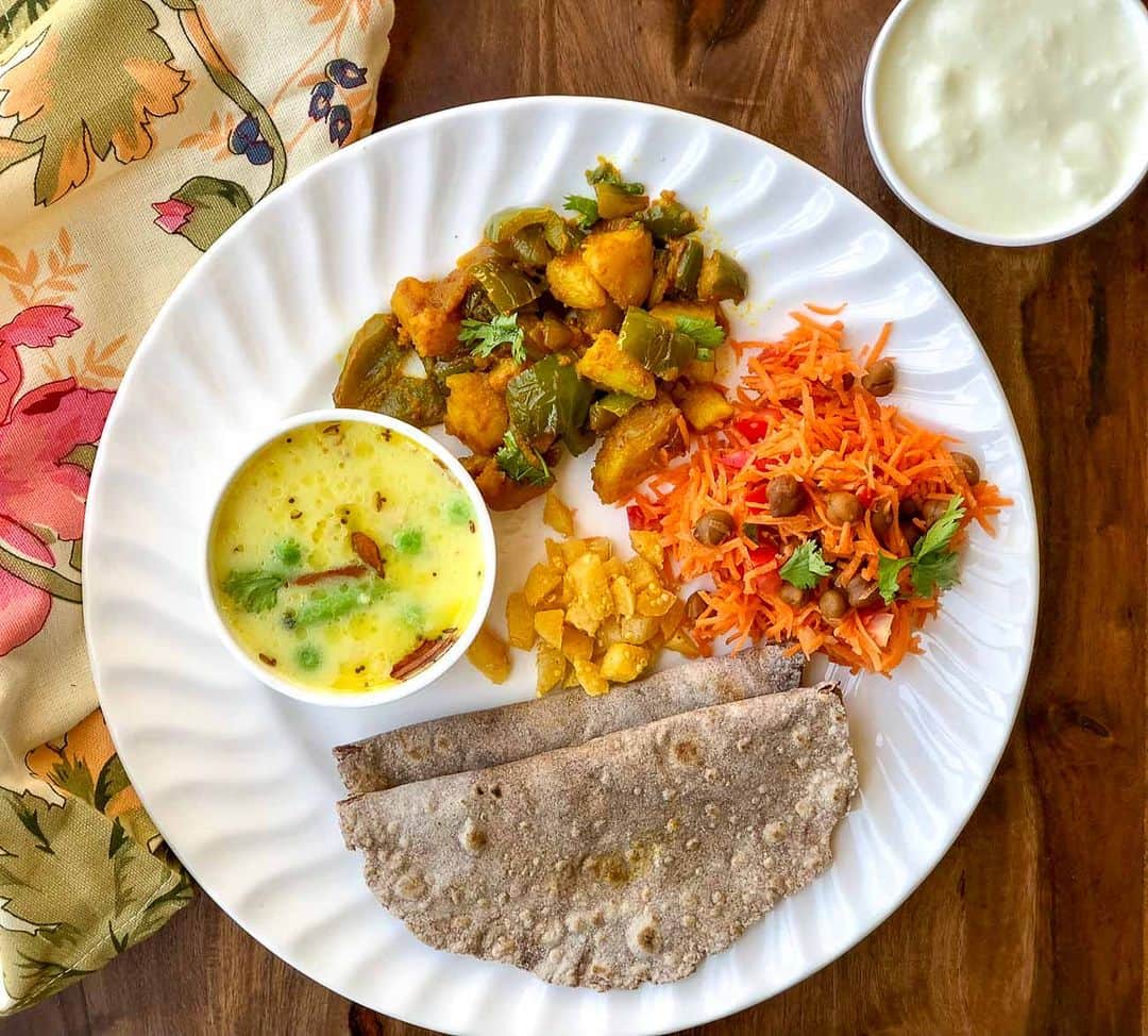 Archana's Kitchenのインスタグラム：「An idea for a Sunday lunch or even a weeknight dinner. Try this meal plate idea that has Gujarati Kadhi, Aloo Capsicum Subzi, Phulka, Salad & Pickle for a wholesome meal. Notice that this meal is packed with a lot of proteins and good fats. The meal is simple and packed with the goodness of potatoes, salad, and a multigrain roti that you'll all enjoy :)  Comment "YES" for the full recipes. We will DM you the recipe link.  #meal #lunch #lunchplate #lunctime #southindian #southindianfood #meals #southindianmeals #summer #salad #lovesalad #healthy #healthyfood #healthymeals #archanaskitchen #recipes #healthyeating #healthyfood #healthyrecipes」