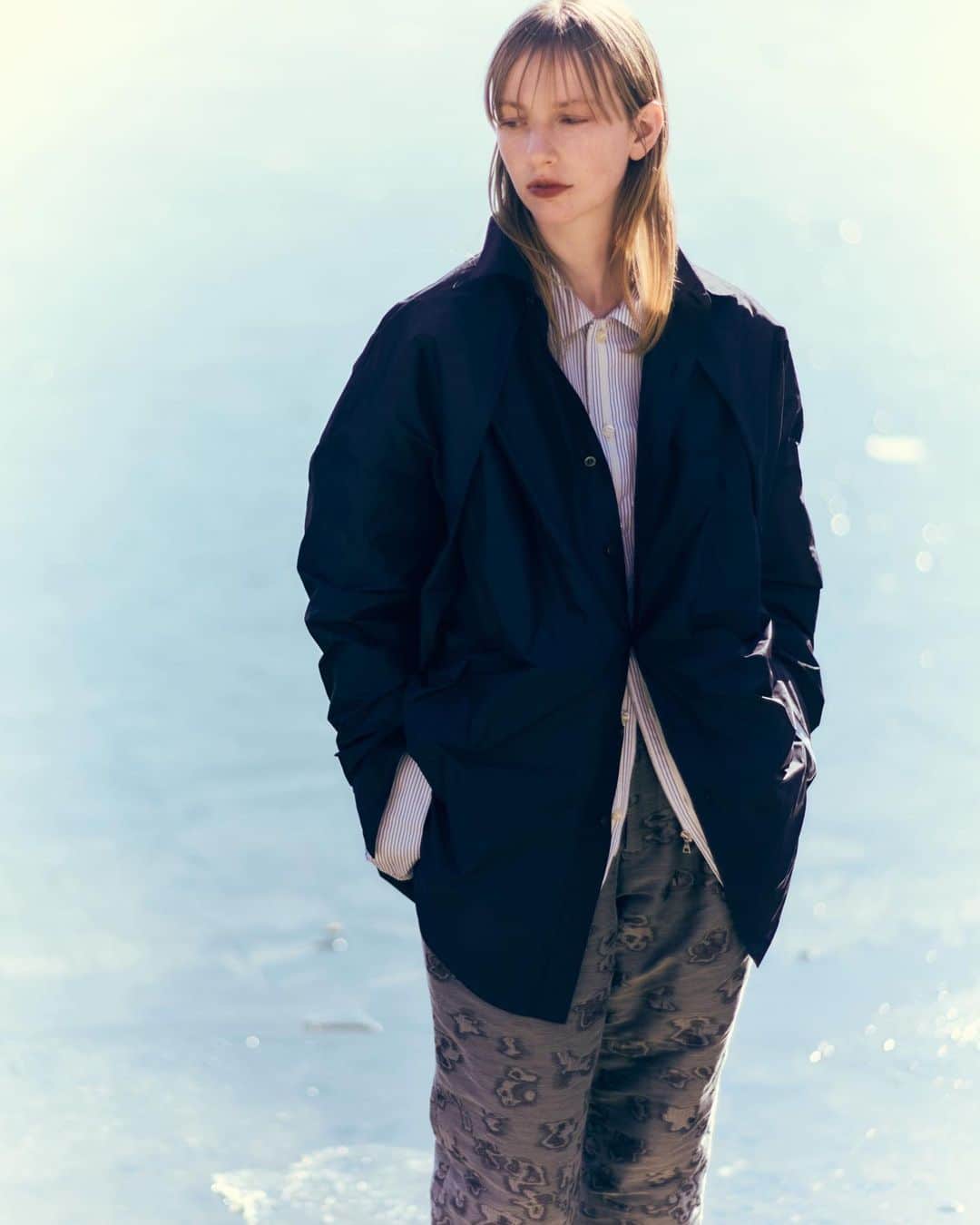 メアグラーティアのインスタグラム：「meagratia 23FW Collection  - Reflection - LOOK21  Art Direction：Miharu Fujii @hukuwarai_tokyo2020  Styling : @makikimura1226  Flower Artist : @yukarisatoflower  Photographer： @daisuke.ssk  Hair： @kazhironaka  Make-up： @maki_iii  Model： Guillaume (DONNA), @linasuenaert (DONNA)  Photographer Assistant：Tomoki Umeda MD： @bay_seki  Production / Casting： @takahiro_kudose @teeny_ranch_  Designer : @takafumi_sekine  #meagratia #23fw」