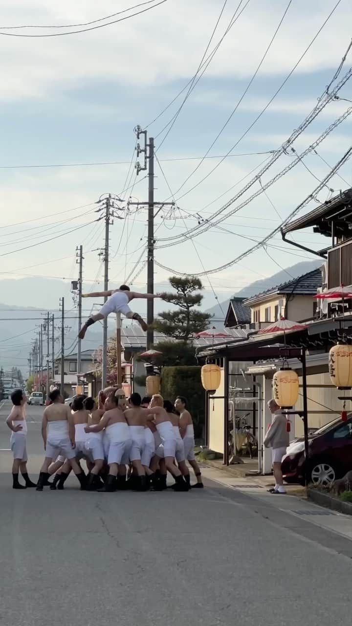 東京DANDYのインスタグラム：「The Furukwa Matusri. ‘Intangible Folk Cultural Property’ of Japan, labeled ‘Intangible Cultural Heritage’ by UNESCO. Austere classifications for what is a visceral and emotive event. It was a five-hour journey from my home in Tokyo through the mountains and valleys of Gifu Prefecture to the highlands of Hida for this event that has taken place for over four centuries. I was here before, in 2019. This was my revenge trip on the past four years - a cyclical moment of personal reckoning. The day began with boys taking drums out of storage at Ketawakamiya Shrine. I overheard them discussing whether the best place to have a cig would be over in the car park or behind the toilets (the toilets won, they were closer). This is the Japan I love, edo-era outfits and electric cigarettes. It’s not a collision of past and present but a synthesis. I witnessed the spiritual start of the procession as the god from the shrine was spirited into the mikoshi, and younger members asked elders, ‘Which way around did the god go?’ Something in that simple exchange expresses the importance of inter-generational relationships that these festivals symbolize. Lion Dancers greeted the start; those lads were dancing non-stop until the end of the festival the following day.   The pomp of the daytime ceremony becomes more primal as the sunsets. Gangs of local men charge into local homes and businesses with ceremonial drums. Large taiko drums are straddled by two ‘lucky’ guys for a three-hour procession around town. The drums become jousts as each local team jostles for the honor of the space directly behind the drums. Hundreds follow carrying lanterns. People of the town take to widows and rooftops to watch. It’s mesmerizing.   The next day is quieter yet ornate. Yatai floats, some over a century old and featuring performers, are paraded around town. When I was here in 2019, the famed ‘kids kabuki’ weren’t performed as there weren’t any kids of the right age, a symptom of japans falling birthrate and rural depopulation. In 2023 they had returned, as a new generation carries the festival into the future.   #古川祭 #古川 #matsuri #festival #Japan #飛騨古川 #Matsuri #Gifu #gogifu」