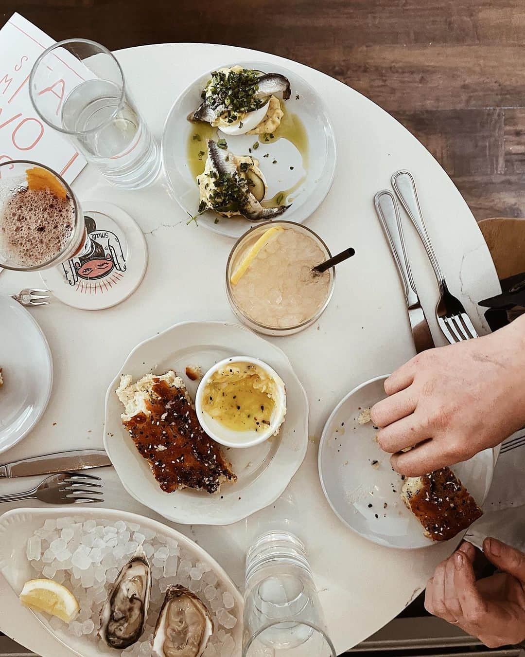 Kate Oliverのインスタグラム：「The month of April in ten pictures — not included were some scary things with my health (I’m okay), our daughter’s first middle school dance, yard work, work-work, and a thousand other things because sharing here is a tiny, tiny fraction of a life.   Pictured: an early dinner date to celebrate eleven years, channeling Daisy Jones for said date, the prettiest red blooms I ever did see in the parking lot of a grocery store, maybe the best cheeseboard I ever put together to hang with @gracieklumpp and @ethan.klumpp, spring light from my yoga mat, dogwood blooms, a happy pretzel (it didn’t come with a face, but I made it have a face), a walk after banh mi sandwiches with @siosidesign and all our dogs, a snag in the chain of my touchstone necklace and a new book.」