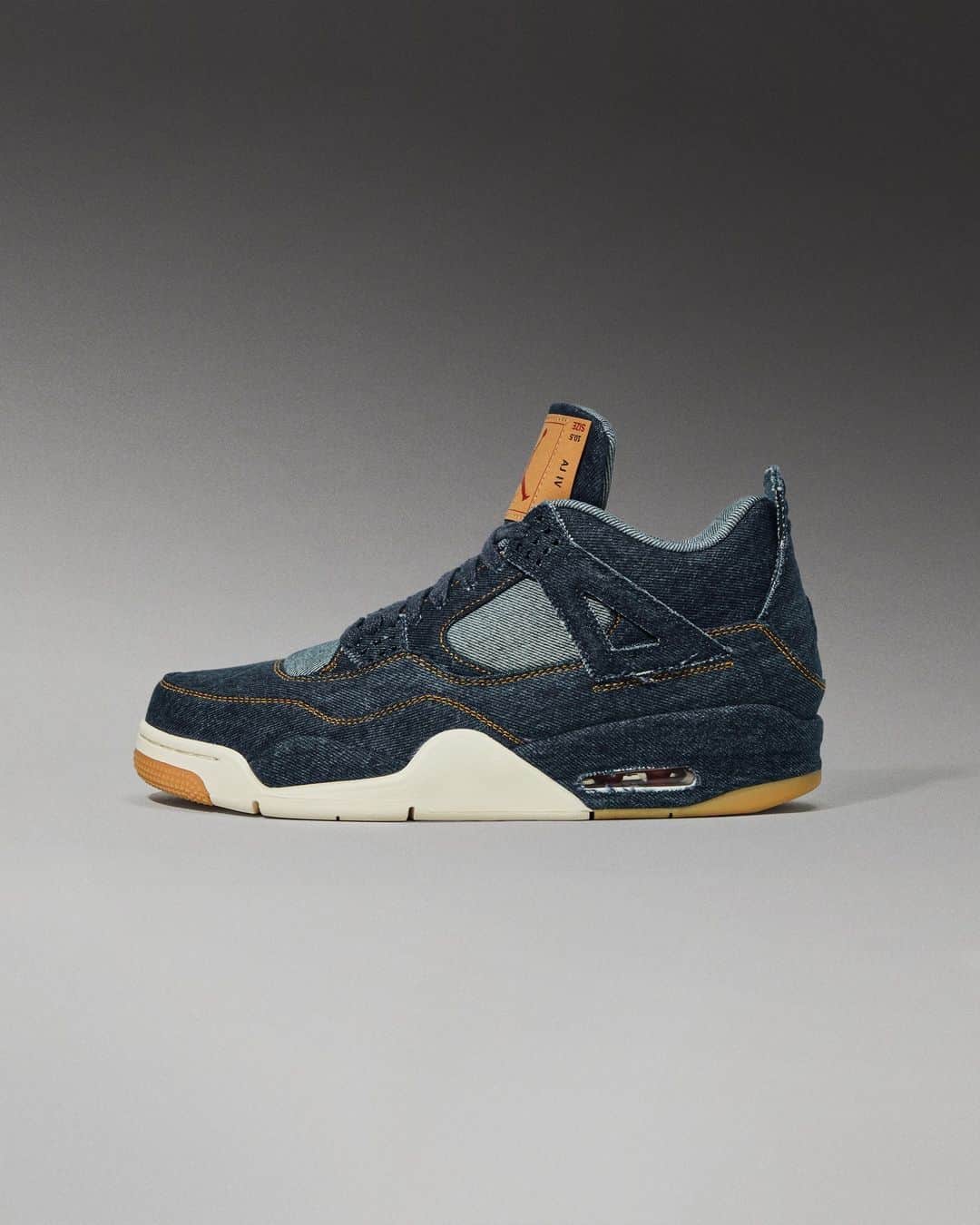 Flight Clubのインスタグラム：「Nike connects with iconic American brand Levi's on the Air Jordan 4 Retro 'Denim.' Indigo washed denim overlays join with bold orange contrast stitching atop the upper. The signature red Levi's hang tag and gum rubber outsole complete the vintage look.」