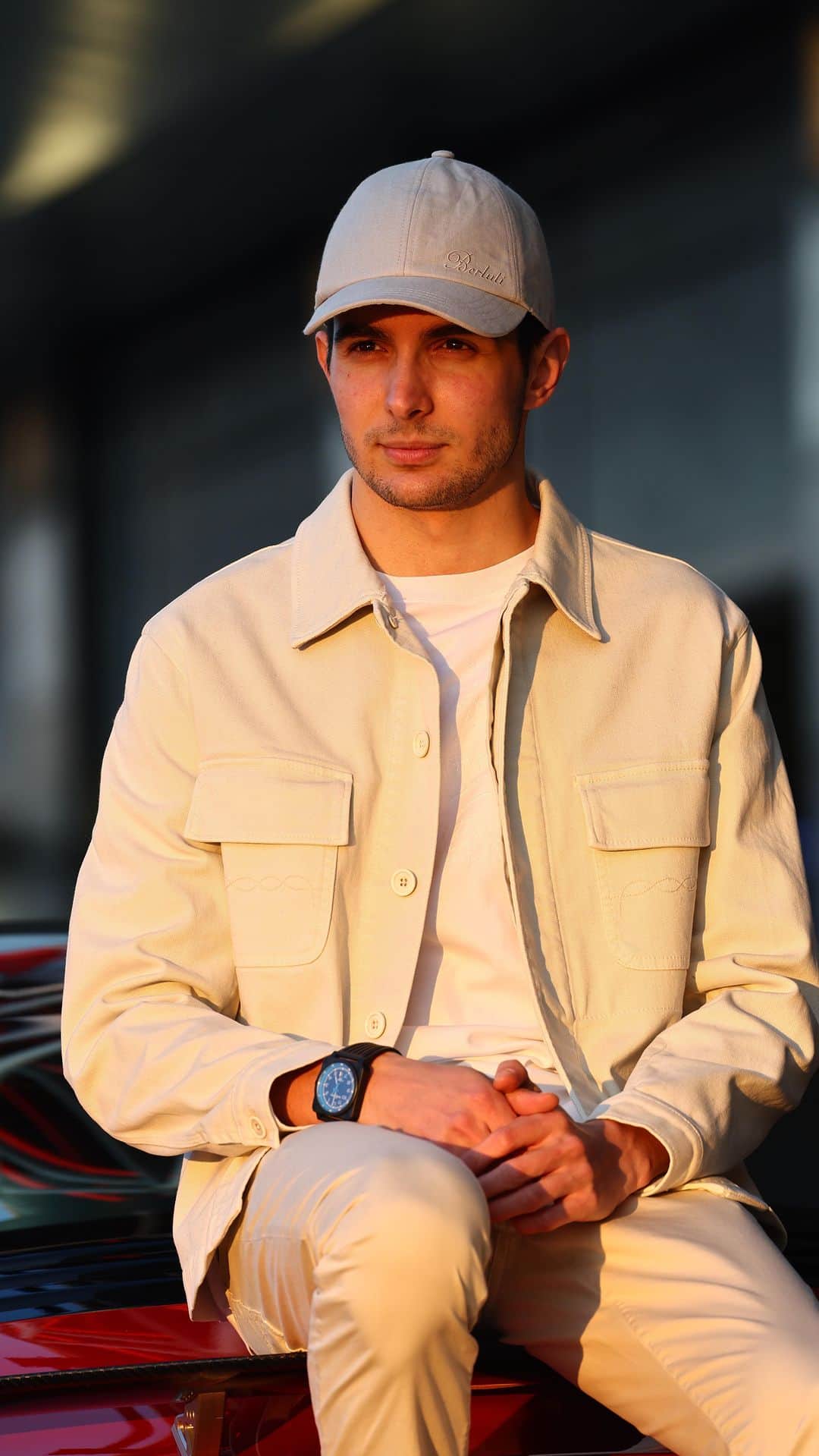ベルルッティのインスタグラム：「- #BERLUTI SUMMER 2023 AS SEEN BY @ESTEBANOCON -   Berluti is the official elegant partner of @alpinef1team for the 2023 season.  The colours are neutral, the attitude is not: as he prepares to get behind the wheel, BWT Alpine F1 Team Driver Esteban Ocon wears Berluti’s Summer 2023 collection and the new Lorenzo Drive loafers. Available in plain or Scritto-engraved Camoscio leather, and in Summer-ready tones from Pepper to Terra di Siena and Navy, they are perfect for leisurely, sunny drives.   Now available online and in-store.   Stay tuned for a special Berluti x BWT Alpine F1 Team event celebrating the upcoming @f1mia.  Photography by @laurent_charniaux Video by @olivierdescoutey  #BERLUTIXALPINE」