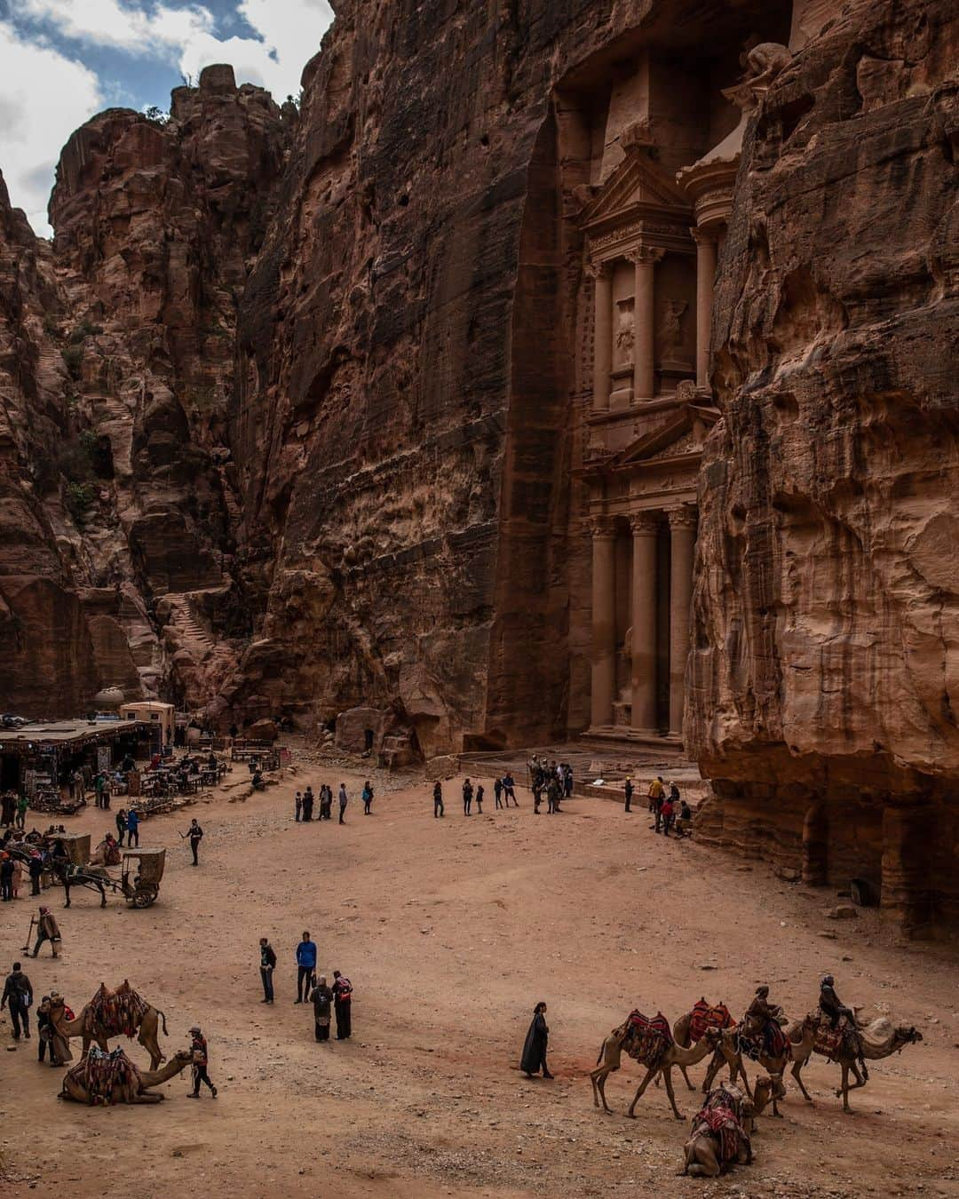 National Geographic Travelさんのインスタグラム写真 - (National Geographic TravelInstagram)「Photo by Muhammed Muheisen @mmuheisen | People gather around Al Khazneh (the Treasury), one of many facades carved into the mountains of the ancient city of Petra in Jordan. For more photos and videos from different parts of the world, follow me @mmuheisen and @mmuheisenpublic.」5月4日 1時00分 - natgeotravel