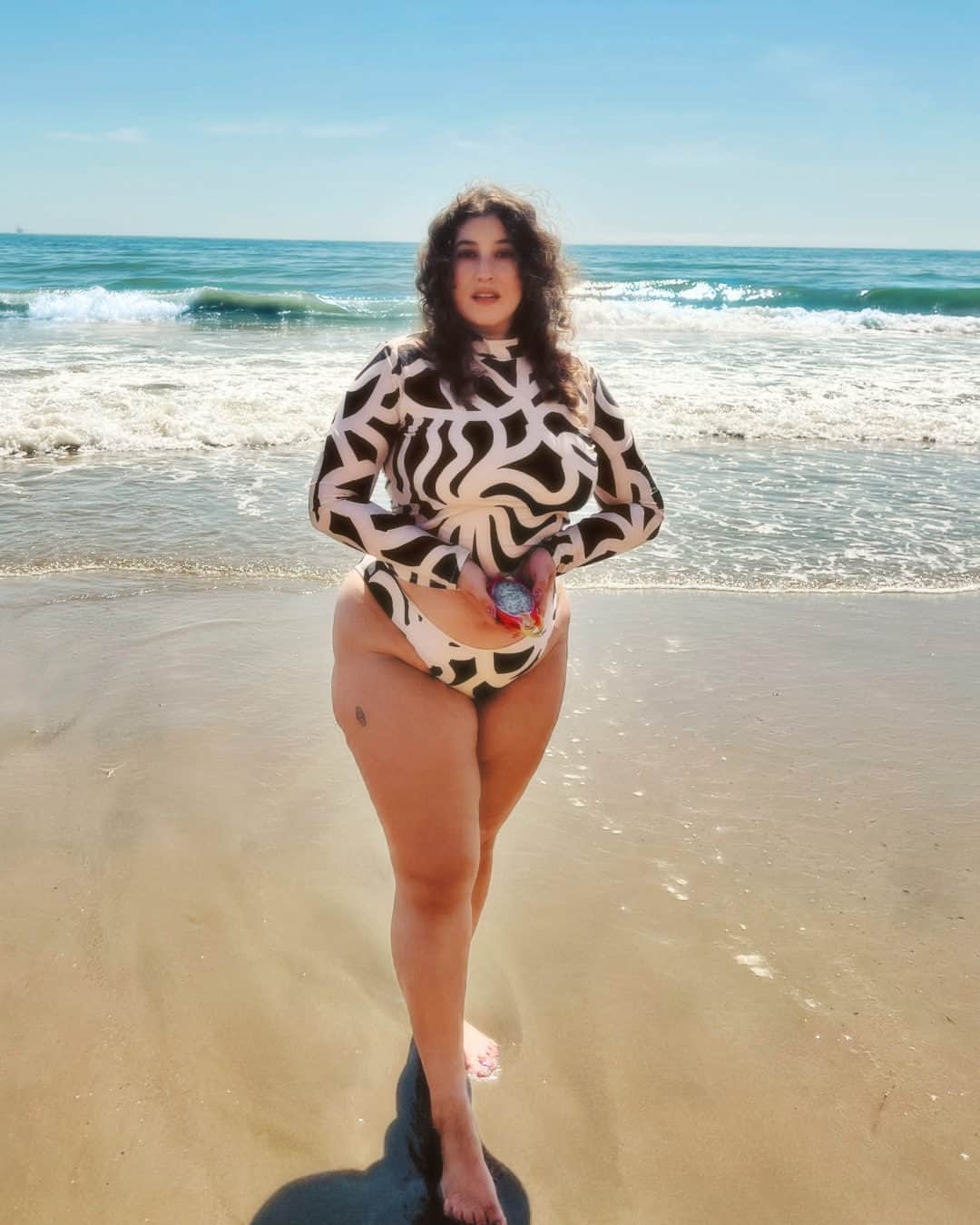 マリメッコのインスタグラム：「Hello, sunshine! Join the beach party with our new swimwear pieces featuring @econylbrand recycled nylon. Our lovely Californian friend @almondmilkmaiden wears the Mavra swimshirt and Hypanthio bikini bottom with UPF 50+ protection. Tap the link in bio to shop the drop. 🌞  #marimekko」