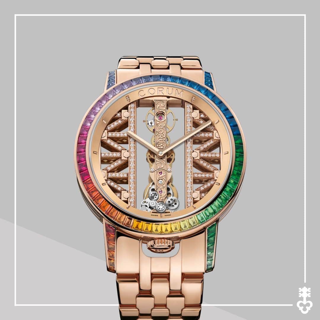 コルムのインスタグラム：「Making a bold and colorful statement, the Golden Bridge 43 is adorned with 68 multicolor sapphires (4.36 cts~), 22 tsavorites (1.48 cts~), and 6 rubies (0.54 cts~) in a rainbow gradation.  Limited to 18 pieces worldwide, find out more about this exquisite timepiece: bit.ly/GoldenBridge-43-RG-Baguette   (Ref. B113/04454)  #Corum #CorumWatches #CorumGoldenBridge」