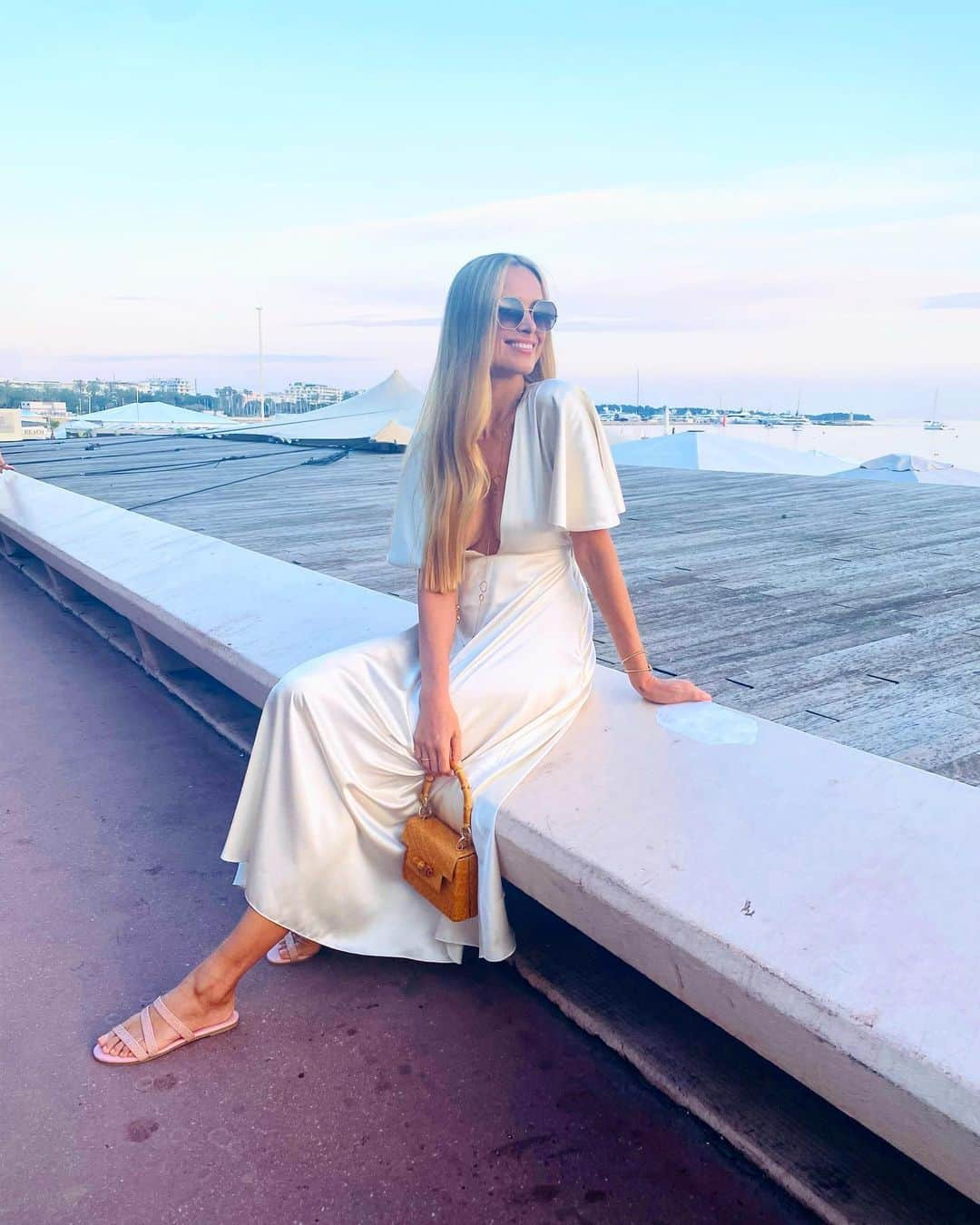 ペトラ・ネムコバのインスタグラム：「So grateful for the blessed times in Cannes in between red carpets. ☺️  💚Loving these #ConsciousFashion outfits.   Stunning Dress by @sanikai_clothing & Shoes by @_shopnayla & @_serpui bag made from wicker and has a bamboo handle   Bodhi outfit by @quincymae & Shoes by @inkkasworldwear.   #Cannes2023」