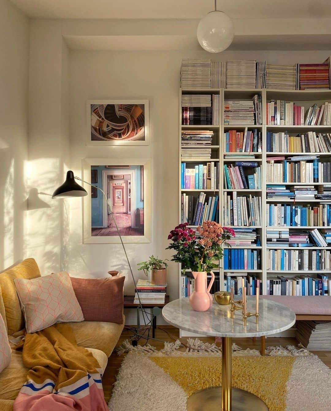 近藤麻理恵のインスタグラム：「I love how these bookshelves are surrounded by beautiful pops of color! Is there a room or place in your home that sparks the most joy?   Photo courtesy of @fedesfotos」