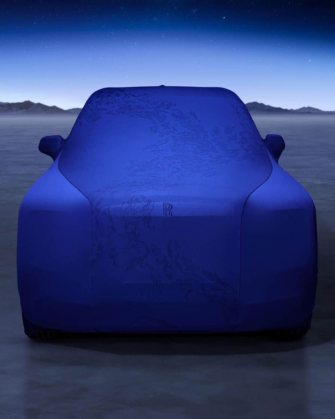 ロールス・ロイスさんのインスタグラム写真 - (ロールス・ロイスInstagram)「Black Badge Cullinan Blue Shadow’s front and rear seats reveal a vivid image of the Earth’s surface.  Each seat displays 75,000 individually placed perforations that encapsulate Earth’s organic cloud patterns swirling above oceans and continents.  The intricate pattern is mirrored on Blue Shadow’s indoor car cover, enticing onlookers to imagine what awaits beneath.  Discover #BlackBadge Cullinan Blue Shadow; link in bio.  #BespokeIsRollsRoyce  — NEDCcorr (combined) CO2 emission: 343 g/km; Fuel consumption: 18.7 mpg / 15.1 l/100km WLTP (combined) CO2 emission: 377-370 g/km; Fuel consumption: 17.0-17.3 mpg / 16.6-16.3 l/100km. Further information: https://www.rolls-roycemotorcars.com/en_GB/information/fb-dat-wltp.html」6月1日 23時01分 - rollsroycecars