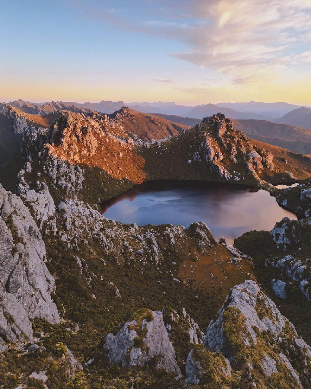 Australiaのインスタグラム：「The rules in @tasmania are simple - if the mountains call, you answer! 📞⛰️ Kudos to @moistmark for capturing the spectacular view of #LakeOberon in #Tassie's South West National Park. Accessible only by your own two feet, it's time to strap on those hiking boots - this is one of #Tasmania's most challenging hikes. But don't worry, the view at the end will have you feeling lake-a-million bucks! 😉 #seeaustralia #comeandsaygday #discovertasmania #hobartandbeyond」
