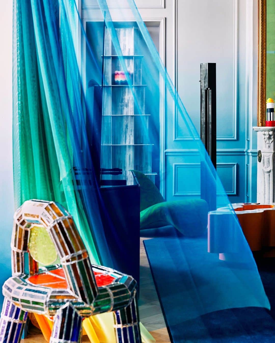 ELLE DECORさんのインスタグラム写真 - (ELLE DECORInstagram)「In this classic Haussmannian building near Paris’s Champs-Élysées, a young, worldly couple threw caution to the wind and gave in to their love of color with the help of French studio Uchronia (@uchronia_world). And these ombre-painted silk curtains are just the beginning; A “vitrail chair” by Arthur Ristor sits perched against the window in the living room. It is made entirely of stained glass. “We imagined walking into our jewel box, each gem blown up to an architectural scale,” the wife says. “That is exactly what we got.”   Click the link in bio to tour the rest of this color-saturated residence, as shown in our May 2023 issue. Written by @gaygassmann. Photographed by @felixdolmaillot.」5月9日 23時01分 - elledecor