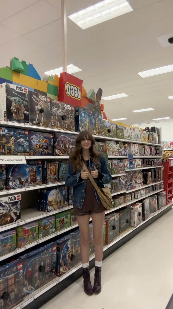のインスタグラム：「Omw & bringing legos! Outfit of ze day!  Details:  Song: Outside by @parquetcourts  Overalls: @urbanoutfitters  Mini sweater: urban Tube top: @brandymelvilleusa  Jean jacket: Vintage Colombia  Rings: @freepeople  Necklace: brandy Legos: @lego @target」