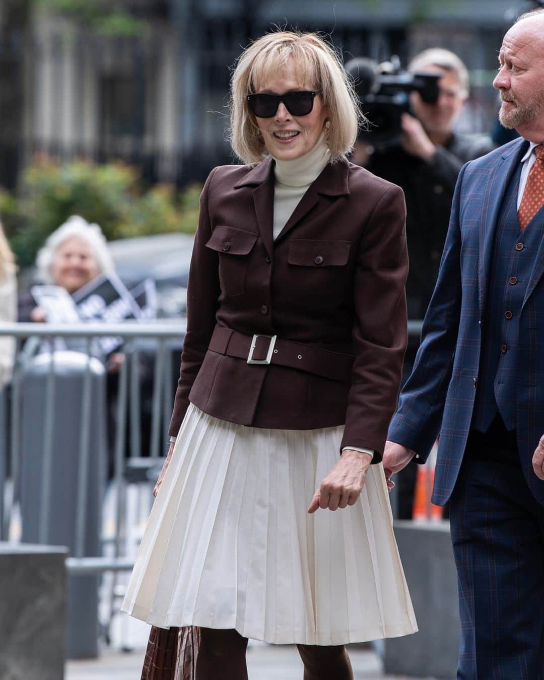 New York Times Fashionのインスタグラム：「On Tuesday, a jury found former President Donald Trump liable for the sexual abuse and defamation of the magazine writer E. Jean Carroll. During the civil trial, every detail was part of building the case — even the clothes, writes chief fashion critic @vvfriedman.  As she sat there in federal court in Manhattan every day, Carroll presented the very opposite of the “wack job” Trump had described in his video deposition. She was an almost perfectly calibrated study in neutrality, calm and composure, both in the way she spoke during her testimony and in the way her appearance spoke for her.  “Optics are critically important in cases of sexual assault and sexual harassment because you have people looking for anything that suggests a victim asked for it or wants attention,” said Debra Katz, a founding partner of Katz Banks Kumin and a civil rights lawyer.  Carroll’s clothes were simple and tailored, with no visible logos. Neat. Respectful but not frumpy. Definitely not showy. Her hair was done in a controlled bob. She wore pantyhose, a generational tell. Her collars were often high and protective.  Read the full analysis of Carroll’s courtroom style at the link in bio. Photo by @brittainynewman」