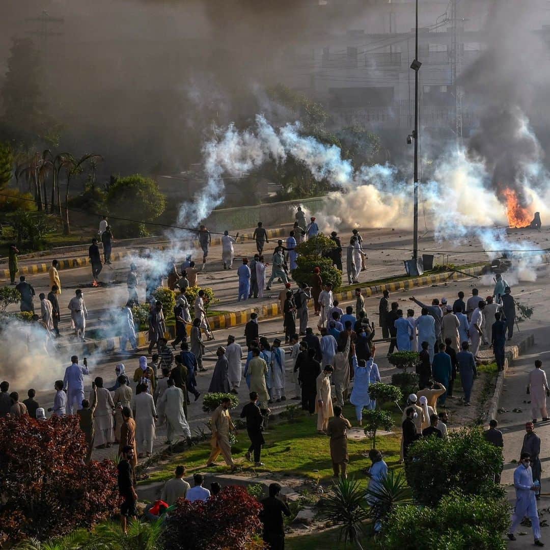 TIME Magazineのインスタグラム：「Former Prime Minister Imran Khan’s arrest has sparked violence in Pakistan.   Images depict police detaining Khan supporters, as well as firing teargas shells towards them and Pakistan Tehreek-e-Insaf party activists in order to disperse them during a protest.  Khan’s arrest came a day after Pakistan’s military issued a rare statement blasting him for repeating allegations that a senior military officer was behind his assassination attempt last year. The 70-year-old former cricket star has regularly criticized members of the military, Pakistan’s most powerful institution, since he was ousted as prime minister in April last year.  Link in bio.  Photographs by 1: Abdul Majeed—AFP/Getty Images; 2: K.M. Chaudary—AP; 3: Arshad Arbab—EPA-EFE/Shutterstock」