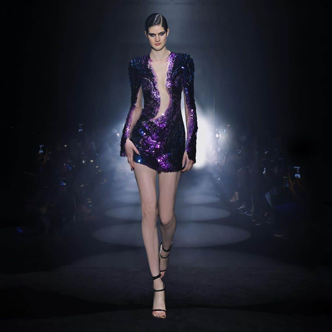 ジュリアンマクドナルドのインスタグラム：「Evoking an enchanting magnetism and elegance, a celestial @JulienxGabriela muse takes center stage on the runway wearing an asymmetric couture mini dress, intricately hand-embellished with tonal ombre swirls of amethyst purple and midnight blue sequins contouring the body in a mesmerising spiral with a dusting of Swarovski sapphire and tanzanite crystals and finished with a signature statement shoulder embellished with hand cut 3D pietts  Big thank you to all who contributed to a successful JULIENxGABRIELA AW24 show:  Styling: @karlplewka Makeup: @wendyrowe Hair: @sammcknight1 Nails: @glitterbels Shoes: @charkviani Belts: @jivomir.domoustchiev Tanning: @cocoandeve Production: @mybeautifulcity Music: @djsmokinjo Casting: @angusctmunro PR: @purplepr Official Sponsor: @weshopsocial」