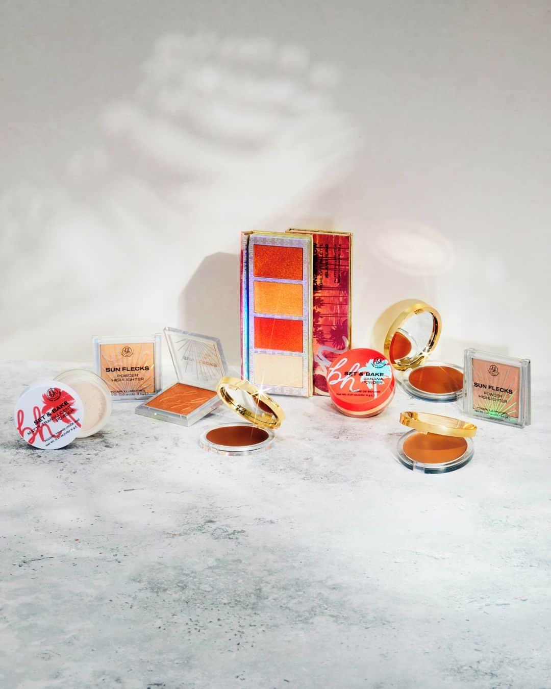 のインスタグラム：「Look & feel hot in our NEW summer complexion faves ☀️ Keep that face on lock all summa long 🔒 with budge-proof faves that beat n' bring the heat 🔥⁣ ⁣ ✨ NEW Summer Heat Cream Bronzers: Weightless cream formula for a soft, dewy, bronzed finish. Available in 3 shades!⁣ ✨ NEW Sunset Glow Highlighter Palette: Highly pigmented glistening shades in warm, luminous, universally-flattering peach hues⁣ ✨ NEW Set & Bake Setting Powders: Setting powders with a light-as-air, super smooth, ultra-fine formula. Available in 3 shades!⁣ ✨ NEW Sun Flecks Highlight Singles: Lightweight, soft-focus, versatile pressed powder highlighters. Available in 5 shades!⁣ ⁣ All these hot drops are ⬇️⁣ 🌱 Vegan⁣ 🧼 Clean⁣ 🐰 Cruelty-Free⁣ ⁣ Which product are you most excited to try?! Let us know in the comments 👇⁣ ⁣ #bhcosmetics」