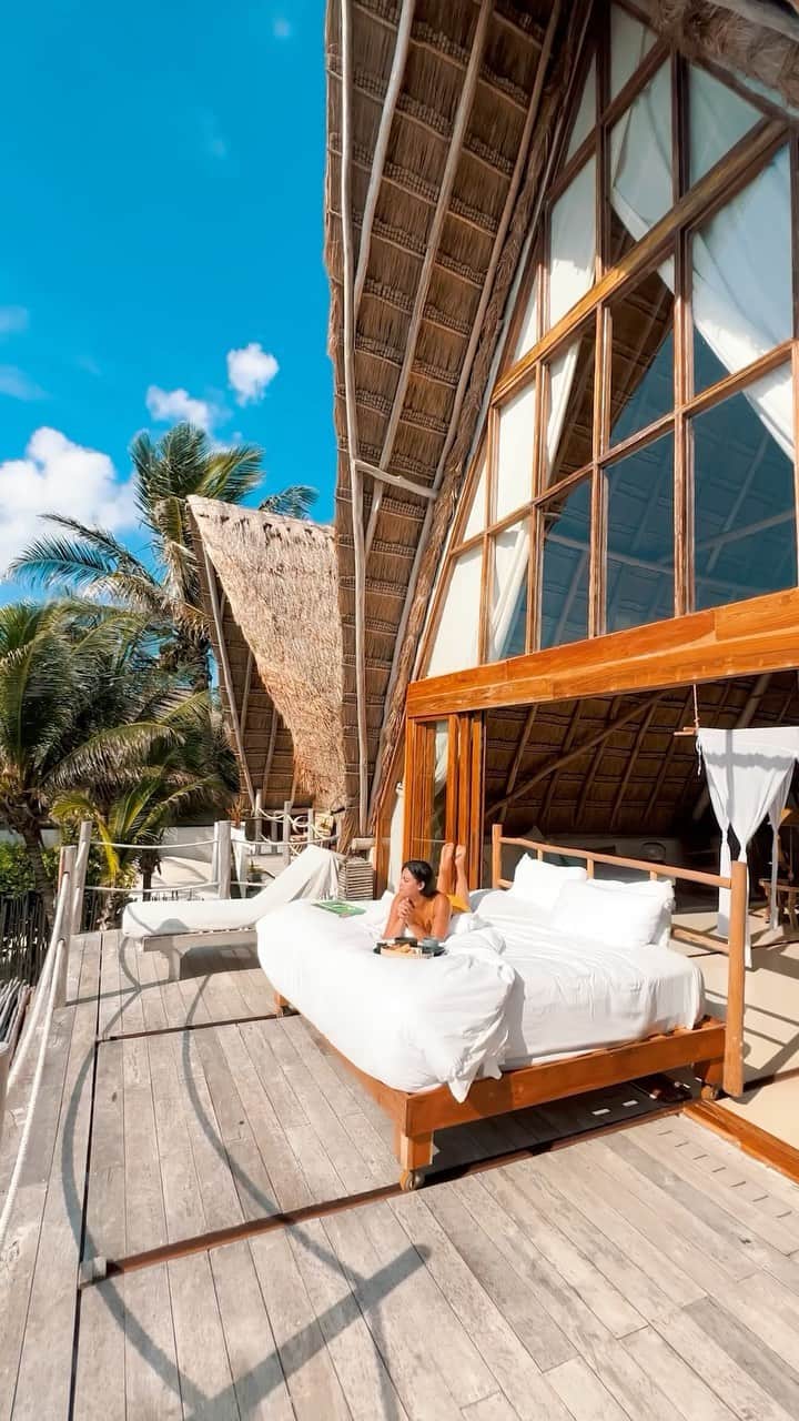 BEAUTIFUL HOTELSのインスタグラム：「@followmypath takes in the breathtaking views from the balcony of their room at La Valise, Tulum. 🌟   This private oasis is the perfect place to unwind and soak in the beauty of the jungle and sea. 🐟  Each room is exotically furnished with curated works of art from local craftsmen and provides access to a salt-water infinity pool just steps away from the Caribbean Sea. 🏊‍♀️   Are you ready to escape to this tropical paradise? 🌴   📽 @followmypath 📍 @lavalisetulum, Tulum, Mexico 🎶 Rick Nelson - I Will Follow You」