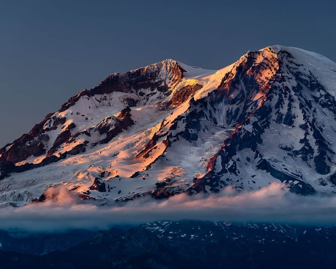 National Geographic Travelさんのインスタグラム写真 - (National Geographic TravelInstagram)「Photo by @stephen_matera | Mount Rainier at sunset in summer, Mount Rainier National Park. At 14,411 feet (4,392 meters), Mount Rainier towers well above the surrounding landscape. It’s difficult to comprehend its sheer size, even when viewed in person, and it never fails to captivate and inspire. Follow me @stephen_matera for more images like this from Washington and around the world. #MtRainer #RingOfFire #volcano」5月12日 11時00分 - natgeotravel